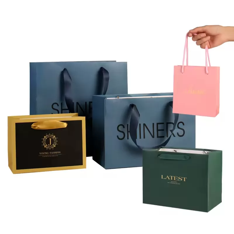 Luxury gift paper bags with ribbon handles custom logo printed by UGI Packaging