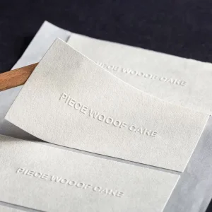 custom embossed white stickers seal labels UGI Packaging manufacturer