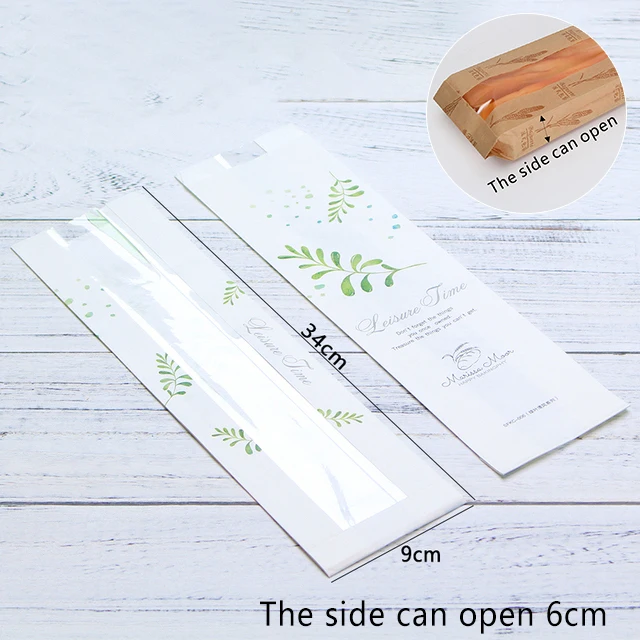 Artisan bakery using oil-resistant kraft paper bags with transparent windows for professional baguette packaging and display