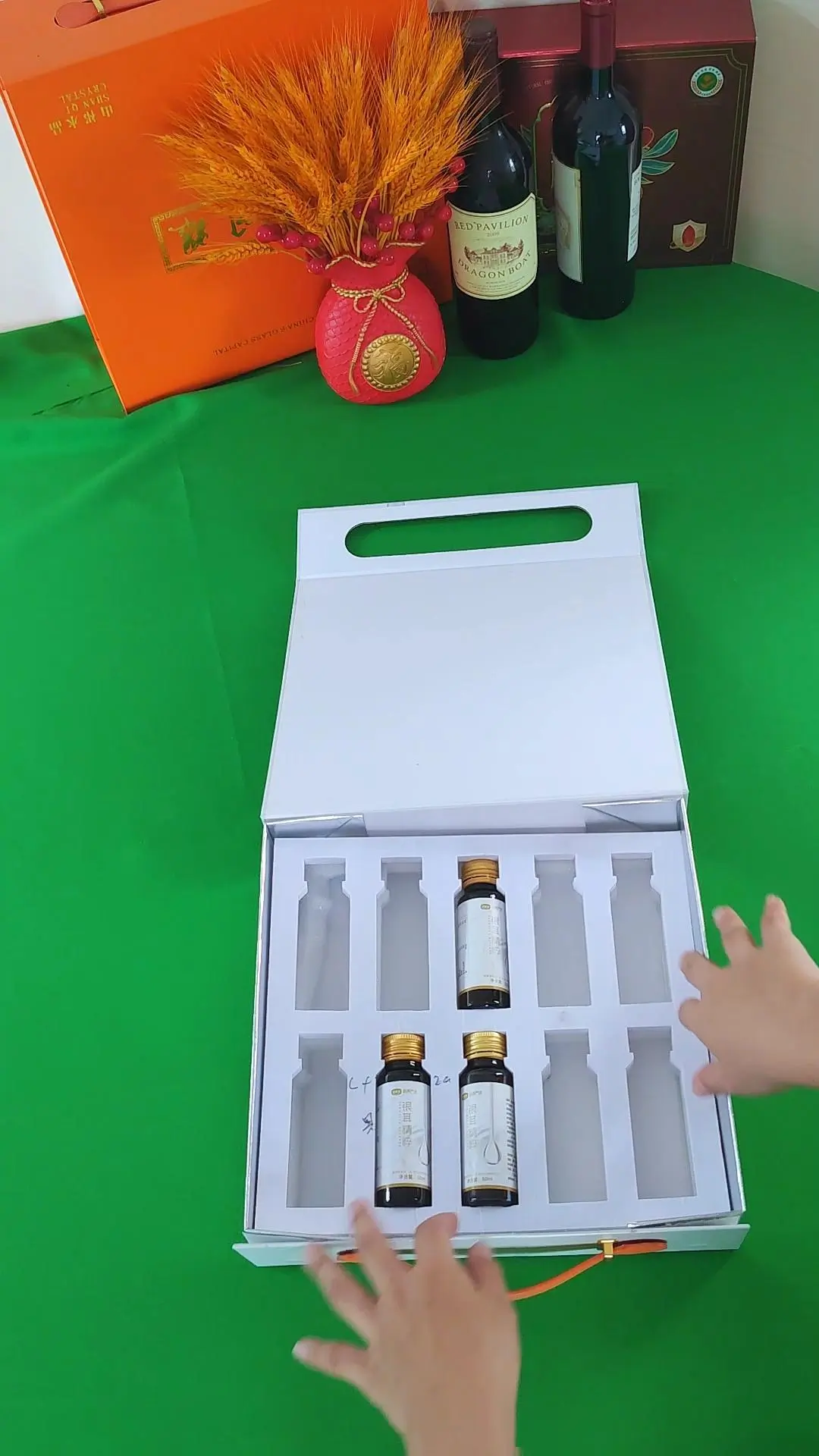 Custom foldable gift box with high-density EVA foam insert for fragile glass vials protection.