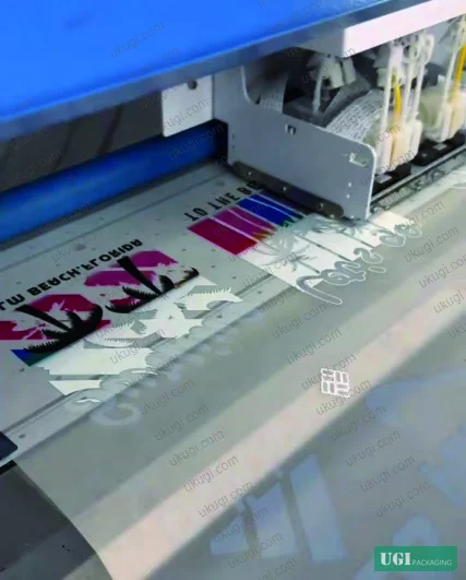 Figure 6: DTF inkjet borderless transfer + foil integration — single-pass color and metallic output with hot-melt powder application