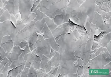 Figure 2: SEM comparison of PVD mirror flake (left) versus ball-milled flake aluminum (right)