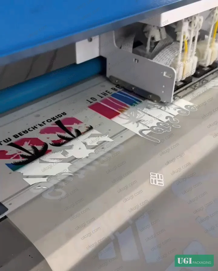 Figure 6: DTF combined foil output — simultaneous white ink, color, and foil adhesive channel printing with hot-melt powder application