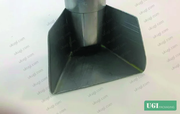 Figure 4: Recovery ink inlets and trapezoidal collector shovels mounted at both ends of the squeegee beam — captures spent ink before it segregates further